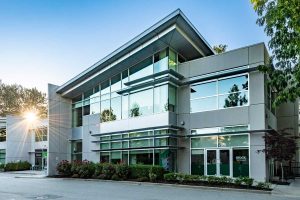 1309 Kootenay large mixed use retail and office building with sunset