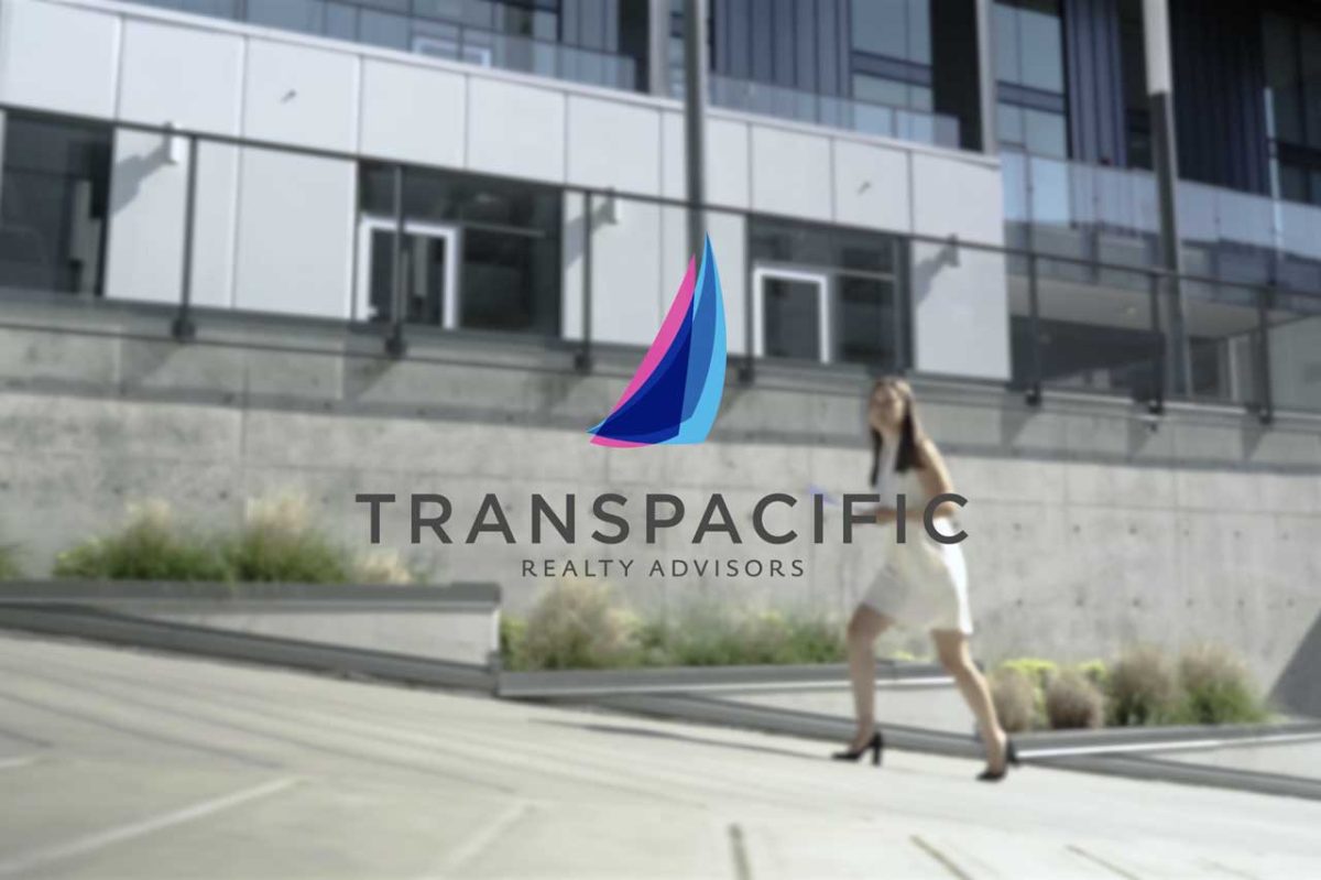 Transpacific Realty Advisors logo woman walking in background